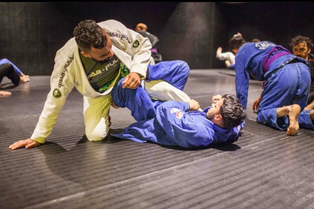 Gi training at BJJ UNION, students drilling guard work